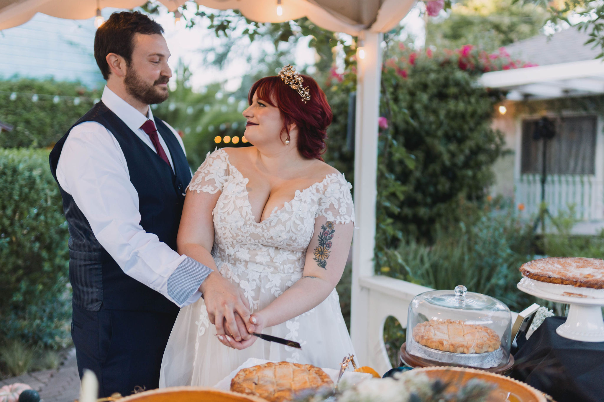 Bride and groom cut their dessert during reception